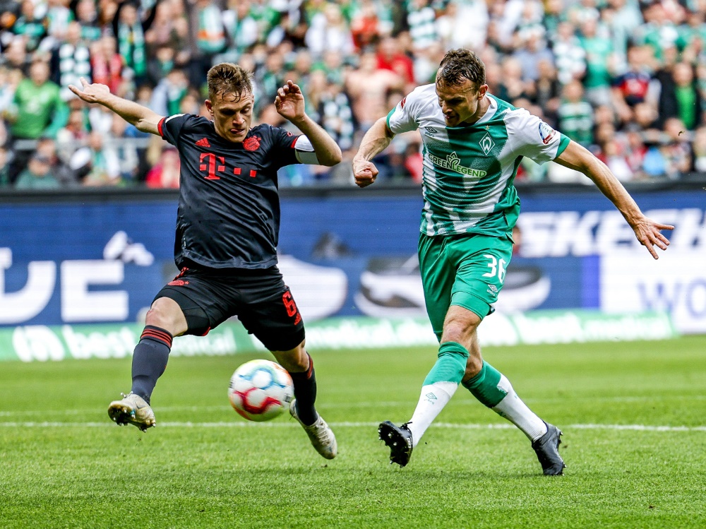 Christian Groß (rechts) macht Schluss. (Foto: AFP/SID/AXEL HEIMKEN)